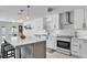 Modern kitchen featuring stainless steel appliances, bright white cabinetry, and a center island with seating at 349 Belleair Ne Dr, St Petersburg, FL 33704