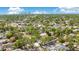 Aerial view of the neighborhood with lush greenery and city skyline in the distance at 3512 Haines N Rd, St Petersburg, FL 33704