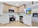 Well-equipped kitchen featuring stainless steel appliances, two-tone cabinets and a bright, modern design at 3512 Haines N Rd, St Petersburg, FL 33704