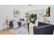Stylishly designed living room with modern furnishings, hardwood floors and plenty of natural light at 3512 Haines N Rd, St Petersburg, FL 33704