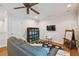 Cozy bonus room with wood floors, ceiling fan, and playroom area at 3710 W San Pedro St, Tampa, FL 33629