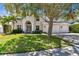 Elegant two-story home featuring a lush front lawn, a mature shade tree, and a three-car garage at 3710 W San Pedro St, Tampa, FL 33629