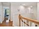 Upstairs hallway features wood floors, white walls, and leads to several rooms at 3710 W San Pedro St, Tampa, FL 33629