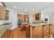 Large kitchen featuring granite countertops, wooden cabinets, stainless steel appliances, and an island at 3710 W San Pedro St, Tampa, FL 33629