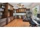 Office with custom wood built-ins, desk space, and a ceiling fan for a comfortable work environment at 3710 W San Pedro St, Tampa, FL 33629