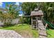 Backyard playground with swing set, slide, and playhouse at 3710 W San Pedro St, Tampa, FL 33629