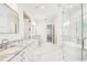 Spacious bathroom with marble countertops, a standalone tub, and a glass shower for a spa-like retreat at 3821 W Vasconia St, Tampa, FL 33629
