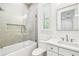 Bright bathroom featuring subway tile, a glass shower door, and marble vanity at 3821 W Vasconia St, Tampa, FL 33629