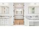 Elegant bathroom with double vanity, marble countertops, and access to a spacious walk-in closet at 3821 W Vasconia St, Tampa, FL 33629