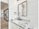 Bathroom features a marble countertop, black faucet, and modern mirror above the vanity at 3821 W Vasconia St, Tampa, FL 33629
