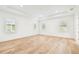 Bright primary bedroom boasts wood floors, recessed lighting, and three windows at 3821 W Vasconia St, Tampa, FL 33629