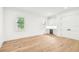 Bright bedroom with light hardwood floors, plantation shutters and a built-in bar at 3821 W Vasconia St, Tampa, FL 33629