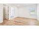 Bright bedroom with light hardwood floors, walk-in closet and ensuite bathroom at 3821 W Vasconia St, Tampa, FL 33629