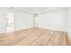 Spacious bedroom with wood floors and natural light that leads to a bathroom and closet at 3821 W Vasconia St, Tampa, FL 33629