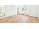 Bedroom featuring hardwood floors, a built in bench below the window, and an ensuite bath at 3821 W Vasconia St, Tampa, FL 33629