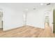 Bedroom featuring hardwood floors, a walk-in closet, and bright natural light at 3821 W Vasconia St, Tampa, FL 33629