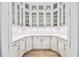 Butler's Pantry featuring marble backsplash and white shaker cabinets at 3821 W Vasconia St, Tampa, FL 33629