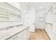 Well-organized walk-in closet with custom shelving, drawers, and marble countertop for storage and style at 3821 W Vasconia St, Tampa, FL 33629