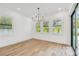 Dining room with natural light from windows and access to outdoor patio at 3821 W Vasconia St, Tampa, FL 33629