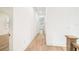 Hallway with wood floors and natural light that leads to an open space at 3821 W Vasconia St, Tampa, FL 33629