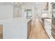 A modern kitchen featuring a center island, stainless steel appliances, and wood floors at 3821 W Vasconia St, Tampa, FL 33629