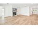 Bright living area featuring a fireplace and open access to other living spaces at 3821 W Vasconia St, Tampa, FL 33629