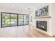 Living room featuring a decorative fireplace and sliding glass doors to outdoor living at 3821 W Vasconia St, Tampa, FL 33629