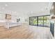 Open-concept layout with living, kitchen, and access to outdoor pool space at 3821 W Vasconia St, Tampa, FL 33629