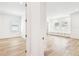 Bright living room featuring hardwood floors, white trim and built-in storage beneath the windows at 3821 W Vasconia St, Tampa, FL 33629