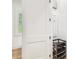View of a room featuring an electrical panel and a storage rack with a window view at 3821 W Vasconia St, Tampa, FL 33629