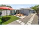 Serene backyard featuring Adirondack chairs surrounding a fire pit, creating a relaxing atmosphere at 4013 W Waterman Ave, Tampa, FL 33609