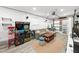 Finished basement featuring retro arcade games, entertainment area, and custom shelving at 4013 W Waterman Ave, Tampa, FL 33609