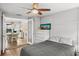 Relaxing bedroom with ceiling fan and seamless transitions to dining room at 4013 W Waterman Ave, Tampa, FL 33609