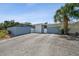 Charming single-story home features an attached garage, privacy fencing and a mature palm tree at 4013 W Waterman Ave, Tampa, FL 33609