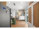 Bright kitchen with stainless steel appliances, stone accent wall, and adjacent dining area at 4013 W Waterman Ave, Tampa, FL 33609
