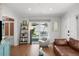 Bright living room featuring hardwood floors, decor, and a view of the backyard at 4013 W Waterman Ave, Tampa, FL 33609