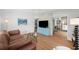 Inviting living room with light hardwood floors and modern decor at 4013 W Waterman Ave, Tampa, FL 33609