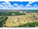Aerial view of a residential area with large lots and beautiful natural surroundings at 41043 Stanton Hall Dr, Dade City, FL 33525