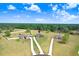 Aerial view of the property showcasing its location, surrounding landscape, and spacious grounds at 41043 Stanton Hall Dr, Dade City, FL 33525