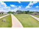 Inviting single-story home with well-maintained landscaping and a long driveway at 41043 Stanton Hall Dr, Dade City, FL 33525