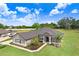 Beautiful single-story home with a well-manicured lawn and inviting curb appeal at 41043 Stanton Hall Dr, Dade City, FL 33525
