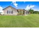 Charming single-story home with a spacious front yard and inviting landscape at 41043 Stanton Hall Dr, Dade City, FL 33525