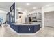 Well-lit kitchen with granite countertops, stainless steel appliances, and stylish cabinets at 41043 Stanton Hall Dr, Dade City, FL 33525