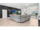 Spacious open-concept living area with tile flooring, modern furniture, and elegant decor at 41043 Stanton Hall Dr, Dade City, FL 33525