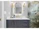 Stylish bathroom with a backlit mirror and striking palm leaf shower tile at 422 24Th N St, St Petersburg, FL 33713