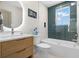 Well-lit bathroom featuring a modern vanity and bathtub-shower combo with elegant tile at 422 24Th N St, St Petersburg, FL 33713