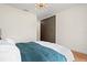 Bedroom featuring a queen-sized bed with white bedding and stylish decor, creating a cozy and inviting atmosphere at 422 24Th N St, St Petersburg, FL 33713