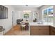 Open-concept kitchen flows into a dining area with sleek quartz countertops and modern, transparent seating at 422 24Th N St, St Petersburg, FL 33713