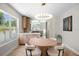 Bright dining area featuring stylish modern lighting and warm wood accents, perfect for cozy meals and entertaining guests at 422 24Th N St, St Petersburg, FL 33713