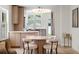 Chic dining area with a round wooden table, surrounded by stylish fuzzy chairs and contemporary lighting at 422 24Th N St, St Petersburg, FL 33713